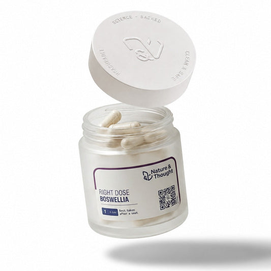 An open clear jar of Nature's & Thoughts Right Dose Boswellia capsules with its white lid propped open, set against a clean white background.